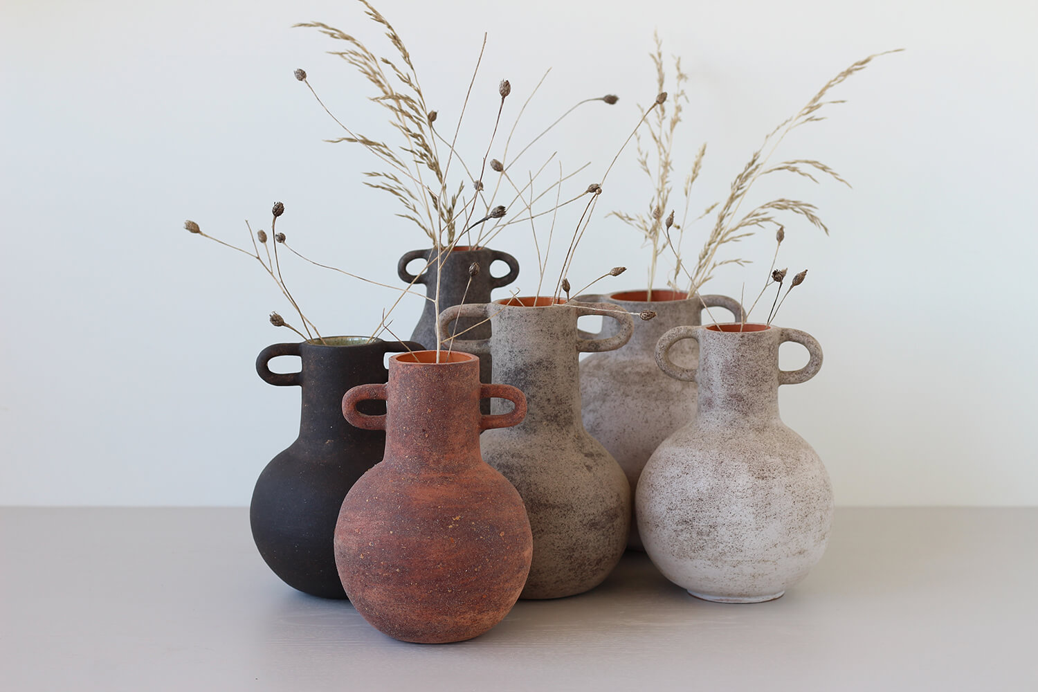 Terracotta vases; red Tomasa, gray Ramona and black Ramona